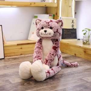Pink long-legged plush cat sitting in a child's room