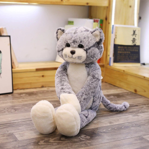 Long-legged grey plush cat sitting in a child's room