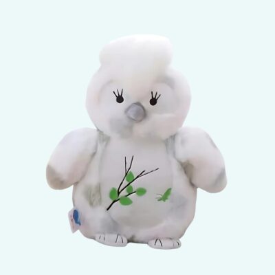 Kawaii owl plush on a light blue background.
