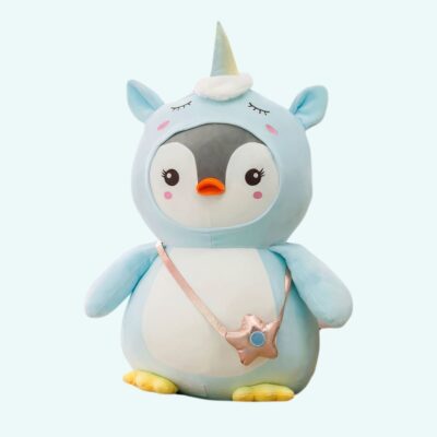 Penguin plush with blue unicorn costume on a light blue background.