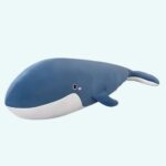 Giant blue whale plush on a light blue background.