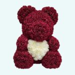 Pink and purple teddy bear collector's box on a light blue background.