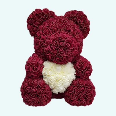 Pink and purple teddy bear collector's box on a light blue background.
