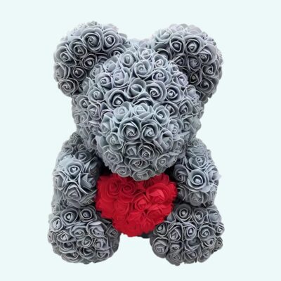 Teddy bear grey roses collector's box on a light blue background.