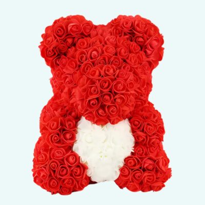 Teddy bear red roses collector's box ona light blue background.