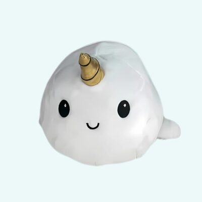 White unicorn whale plush on a light blue background.