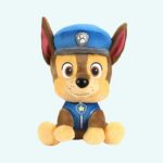 Chase Paw Patrol plush, resembling a small beige and brown puppy in a blue police uniform, sitting upright.