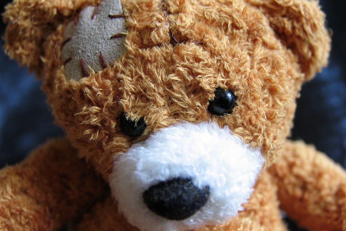 A teddy bear with a cloth sewn on its head