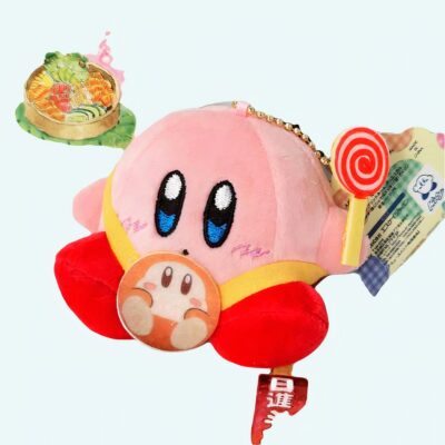 Kirby pink plush, sitting with candy cane