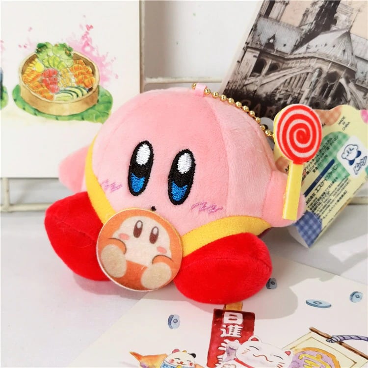 Kirby pink plush, sitting with candy cane