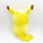 Pokémon Pikachu plush. The plush is yellow and has red pom-poms. There is a suction cup on the top of its head to hang it on a window.