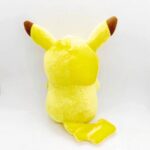 Pokémon Pikachu plush. The plush is yellow and has red pom-poms. There is a suction cup on the top of its head to hang it on a window.