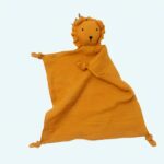 An orange comforter with a lion on a white background