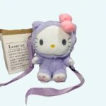 Hello Kitty plush purple backpack sitting next to a basket and a plant