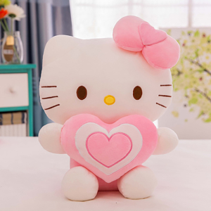 Hello Kitty plush with a heart sitting on a table