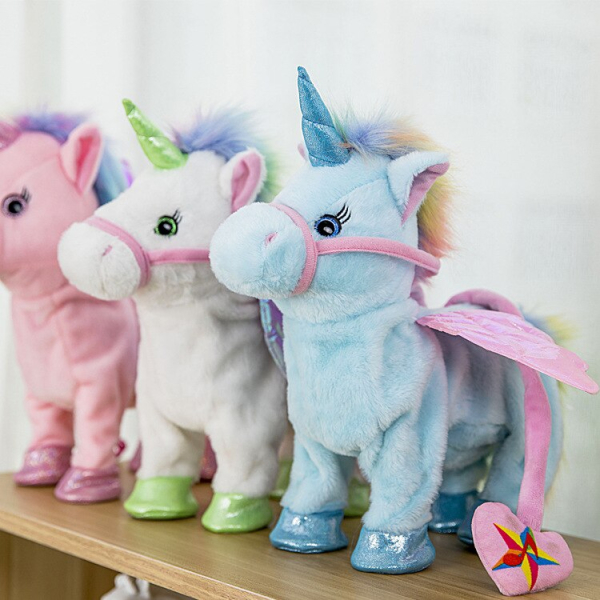 3 plush unicorns placed next to each other on a shelf, one pink, one green, one blue, each with small pink wings