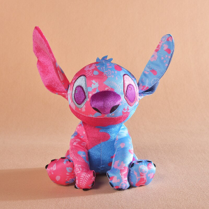 Stitch, the hero of the Disney cartoon, is half coloured in light blue and the other half in pink. He is sitting with his ears in the air