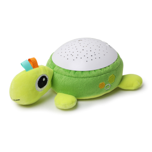 Green turtle plush with a blue and red crest and a white speaker on his back