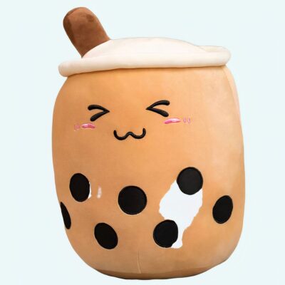 Bubble tea cushion plush, round and brown, laughing. She has black spots on her belly
