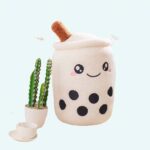 White Bubble tea plush, round and smiling, with little black dots on the belly