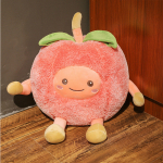 Pink cherry fruit plush sitting on parquet and against a grey wall