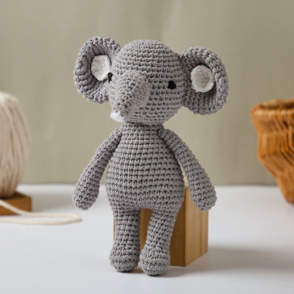 Knitted elephant rattle plush