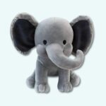 Grey elephant plush on light blue background.