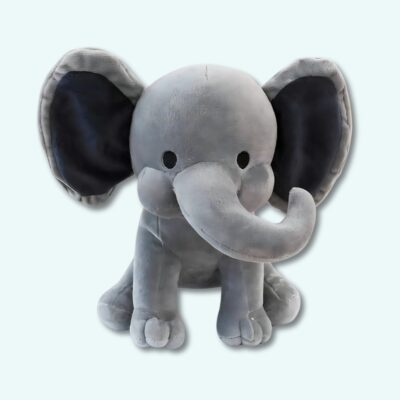 Grey elephant plush on light blue background.