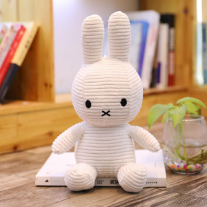 White ribbed Miffy plush with a desktop background