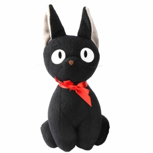 A black stuffed cat, Jiji from Miyazaki's animation film. He has white eyes and a red bow around his neck. On a white background