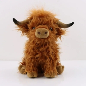 Brown long-haired Highland cow plush with large horns.