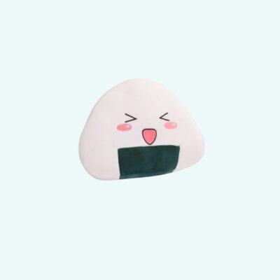 A sushi rice-ball plush pillow with a joyful face, pink cheeks, and a green seaweed band on a light-blue background