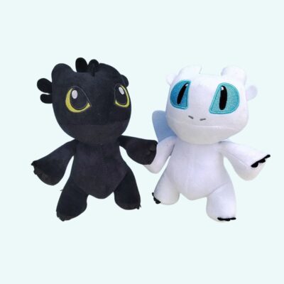 Black and white dragon plush on a white background