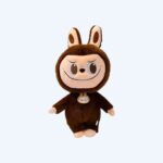 Large Labubu-style plush in a brown animal costume with a mischievous face, on a neutral background