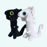 Black or white dragon plush toys on light blue background