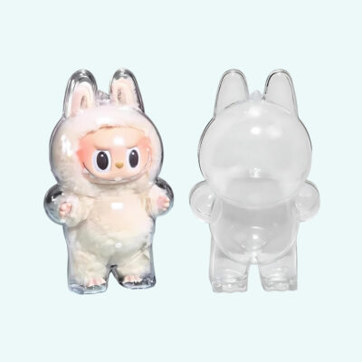 Protective case for standing Labubu-style plush toy, empty on the right and with a white plush inside on the left. On light blue background.