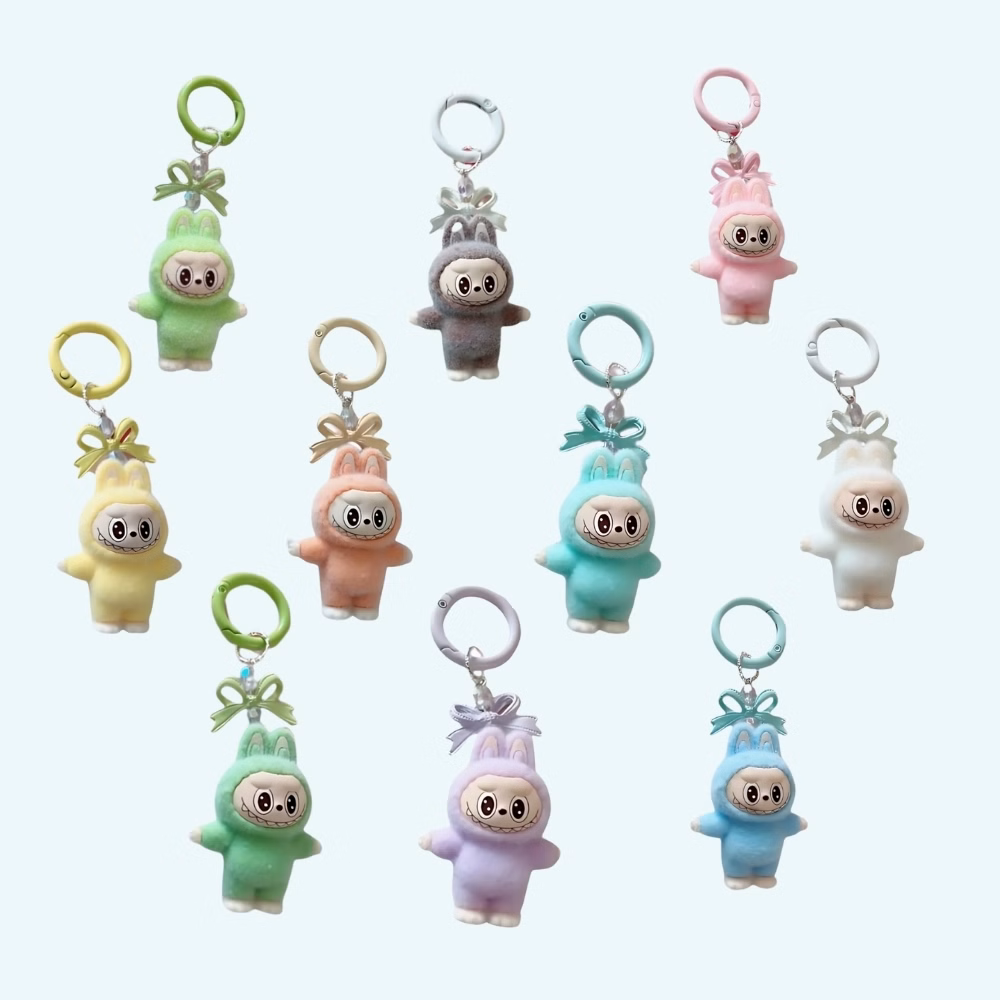 Labubu-style plush mini keychains in 10 different colors on light blue background