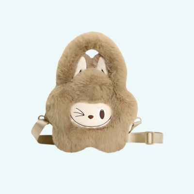 Labubu-style plush handbag in brown with removable shoulder strap. Labubu’s face winks at the center. On light blue background