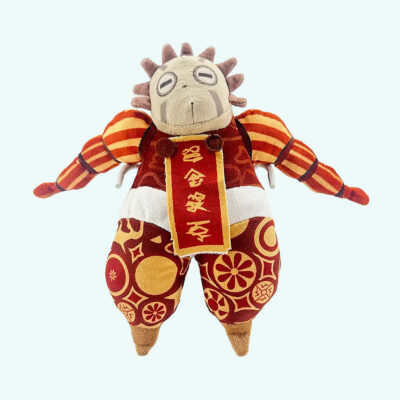 An Esquie plush in red and gold Clair Obscur: Expedition 33 on a solid light blue background