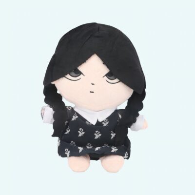 25 cm plush of Wednesday Addams with black braids, a black dress with white flowers, and a stiff white collar. Calm, blank expression. Set against a sky blue background.