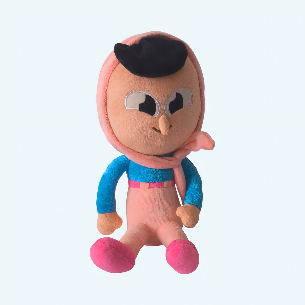 Img_21_07_25_Peluche_Duolingo_Zari_1.Jpeg Zari Duolingo plush sitting, made of beige cotton with pink and blue fabric, soft and sweet-looking. A comforting companion for children ages 3 and up, shown on a plain background.