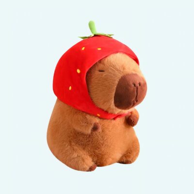 Strawberry hat capybara plush with a fruit-shaped hat on a blue background