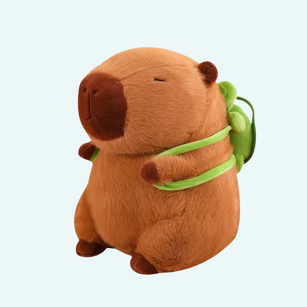 Capybara plush with a turtle-shaped backpack on a white background