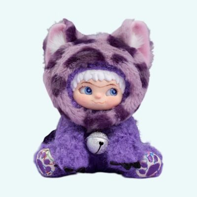 A Wakuku plush – Purple Kool Panther in purple with large ears, a bell around its neck and looking to the side, on a solid light blue background.