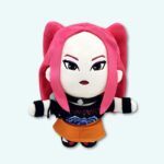 K-pop Demon Hunters plush Mira with pink hair. She’s wearing a black top and an orange skirt. On a plain sky blue background.