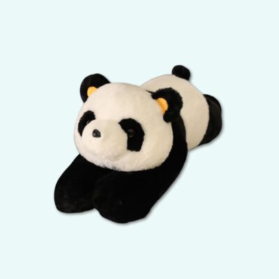 Giant black and white weighted plush panda lying down on a light blue background