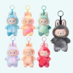Labubu plush keychains in pop colors on a light blue background